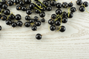 Fresh Raw Black Currant berry on grey wood