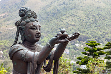 Buddhist statues praising and making offerings to the Tian Tan Buddha (the Big Buddha) at Lantau Island, in Hong Kong. 