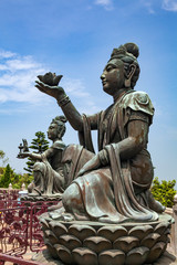 Buddhist statues praising and making offerings to the Tian Tan Buddha (the Big Buddha) at Lantau Island, in Hong Kong. 