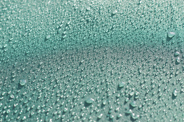 Small drops on a blue surface