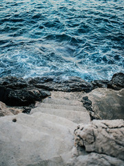 Stairs leading into the sea.