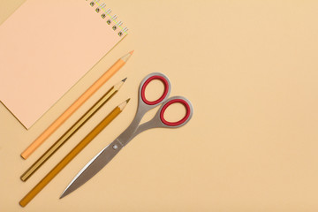 School supplies. Notebook, color pencils and scissors