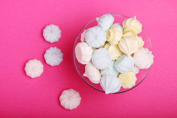 A vase full of meringues cakes
