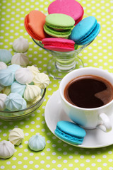 A cup of coffee and macaroons ready for breakfast