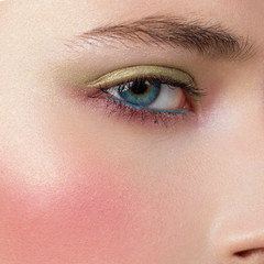 Obraz premium Bright creative make-up of eyes with long eyelashes. Blue color of eyes, pink blush on a brilliant face. Eyebrows, cosmetics and cosmetology