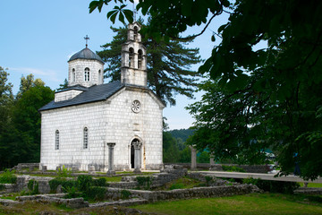 Antique white church in a green environment