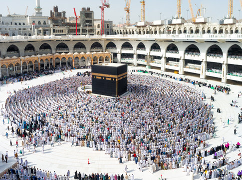 MECCA, SAUDI ARABIA - MAY 07 2018: Amazing and unique photo of people making Salah / Salat / Namaz shot at Asr prayer time. First rakaat, standing position, reading Al Fatiha prayer