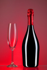 a bottle of champagne with a chalice