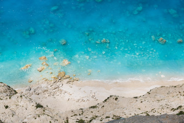 Fototapeta na wymiar Beautiful sandy wild beach with clear water, aerial view