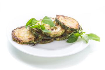 Fried zucchini in a white plate