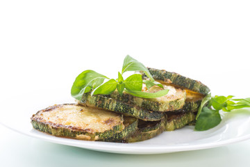 Fried zucchini in a white plate
