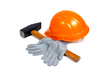 building orange helmet, hammer and gloves on white background
