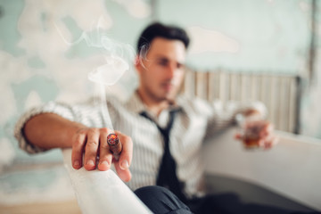 Obraz na płótnie Canvas Businessman smoke cigar in bathtub, suicide man