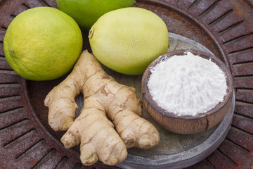 baking soda, lemon and ginger root on the table
