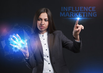 The concept of business, technology, the Internet and the network. A young entrepreneur working on a virtual screen of the future and sees the inscription: Influence marketing