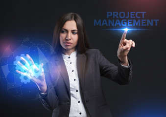 The concept of business, technology, the Internet and the network. A young entrepreneur working on a virtual screen of the future and sees the inscription: Project management
