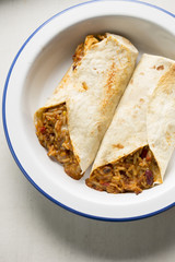 Beef burritos with chilli, rice, corn, beans wrapped in tortillas 