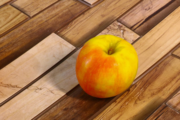 juicy and ripe apple on a wooden background