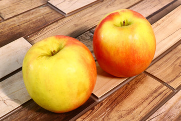 juicy and ripe apples on a wooden background