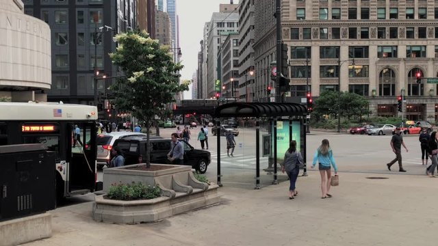 Intersection of North Wabash & Upper Wacker Dr in Chicago Downtown. CTA running in the background. Shot from the wall on the NE Corner of Wacker & Wabash. Wide Shot of intersection