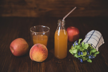 Fresh juice in vintage bottle on wooden table