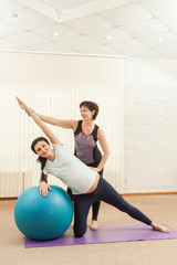 Beautiful pregnant woman doing yoga