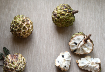 Sugar apples (Annona squamosa) on neutral background.
