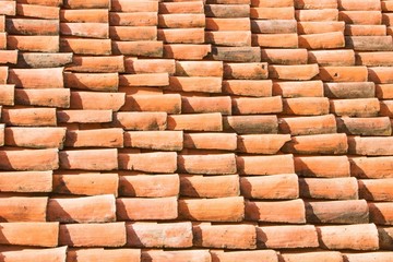 Old tiled roof. Red tile roof background.