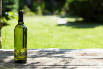 White wine bottle on wooden table © Evgeny Karandaev