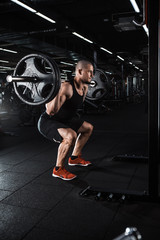 Fototapeta na wymiar Muscular bodybuilder doing squats