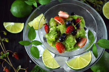 Green granita with matcha tea, lime and mint topped with fresh berries