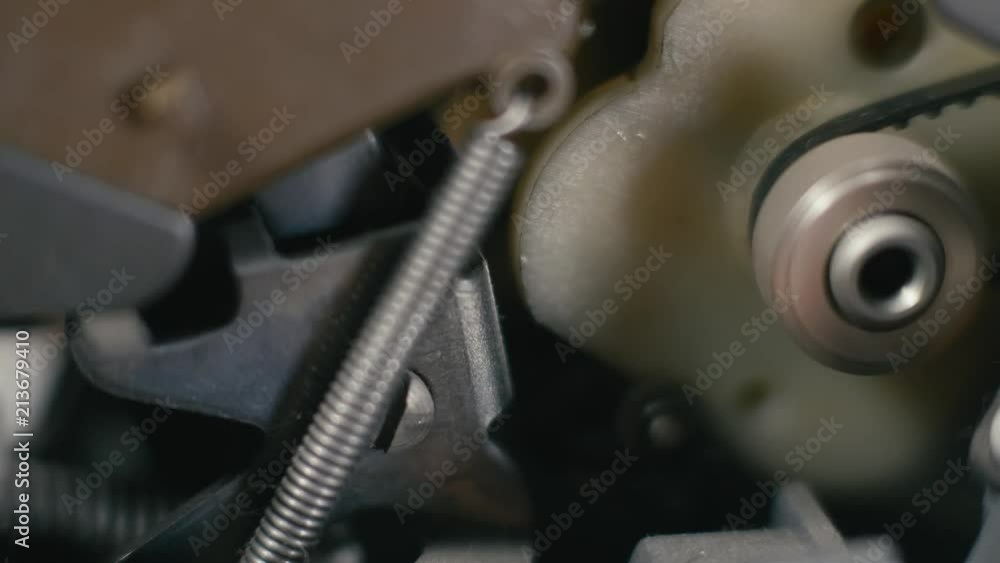 Poster close-up view of an antique mechanical device being powered on. gearbox