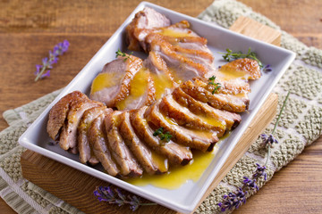 Duck breast with orange sauce on white plate. Duck breast fillet steak. horizontal