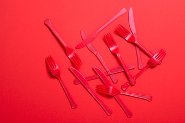Red Forks and Knives on Bright Orange Background, Single Use Cutlery