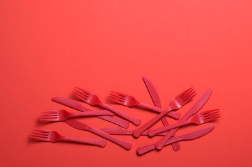 Red Forks and Knives on Bright Orange Background, Single Use Cutlery