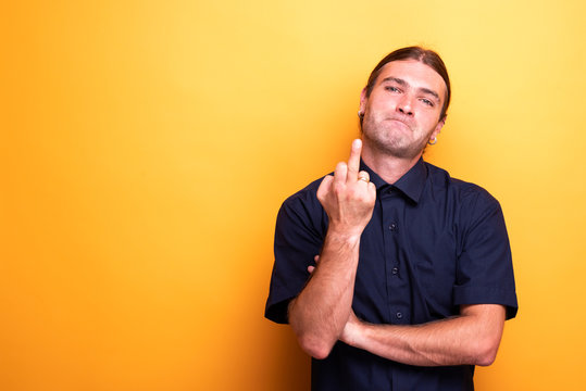 Rude male portrait showing middle finger