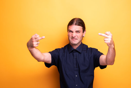 Rude male portrait showing two middle fingers