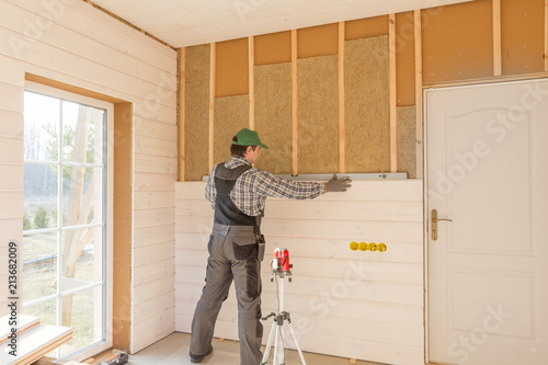 Construction Worker Thermally Insulating Eco Wood Frame House With