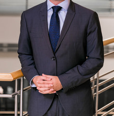 Close-up cropped Caucasian hands and arms of businessman
