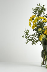 Bouquet of yellow flowers in vase isolated on white background 