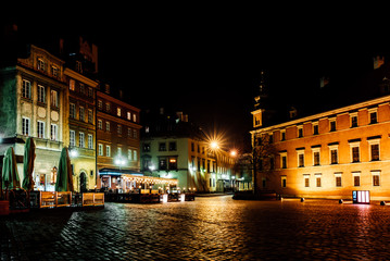 tourist area of the old town in night Warshawa