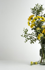 Bouquet of yellow flowers in vase isolated on white background 