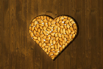 Almonds designed in heart shape with wooden top