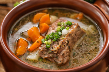 Crock pot with stewed meat, closeup
