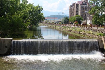 The water falling at the end of the creek though town.