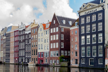 Fototapeta premium Canal houses in Amsterdam reflecting in the water
