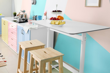 Fruits on table in modern kitchen