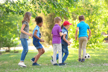 Cute little children playing with ball outdoors on sunny day