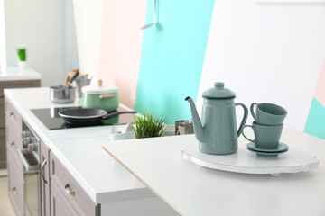 Fototapeta na wymiar Tea set on table in modern kitchen