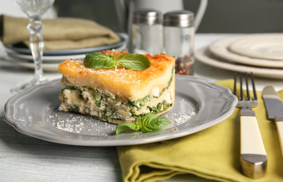 Lasagna with spinach served on table